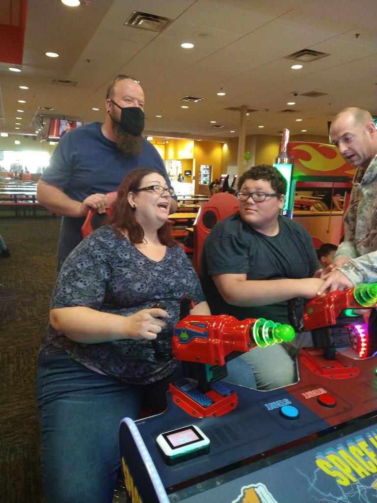 A group of people playing with toy guns.